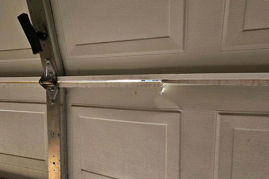 Various types of damage to garage door panels