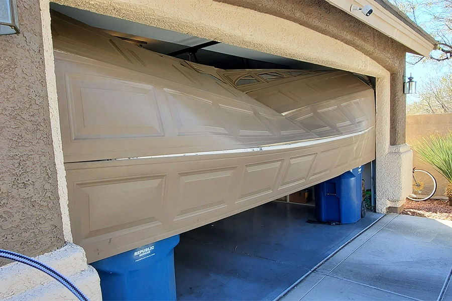 Damaged garage door panel in Las Vegas needs repair