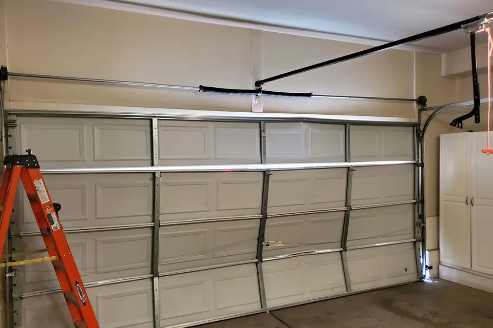 A garage door damaged by a storm in Las Vegas